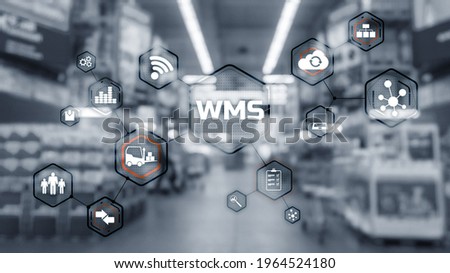 Inscription WMS on blurred warehouse background. Werehouse Management System Royalty-Free Stock Photo #1964524180