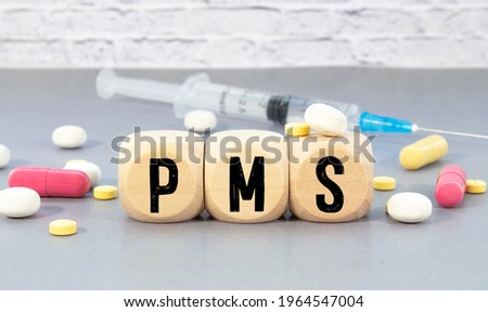 PMS Premenstrual Syndrome acronym on colorful sticky notes Royalty-Free Stock Photo #1964547004