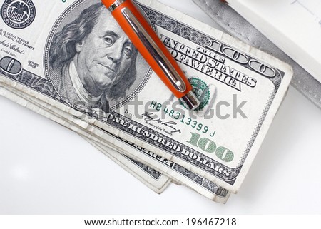 American dollars money with book and pen