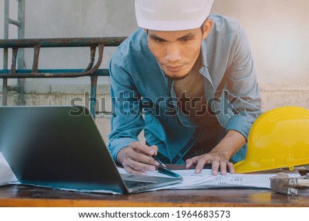 Engineer checking design building construction by computer technology