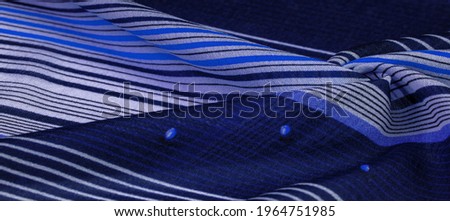 silk fabric, blue background with striped pattern of white and purple lines, mexican theme, mexican poncho costumes. Texture pattern, collection,
