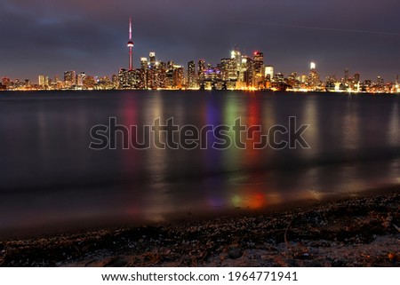 Toronto city night view and reflections at Ontario lake