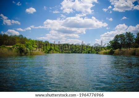 Forest water and beautiful clouds Royalty-Free Stock Photo #1964776966