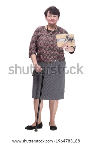 in full growth. elderly woman with a gift box.