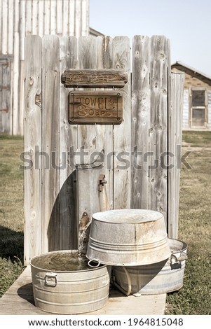 Antique washtubs by the old historic western hotel, Western USA