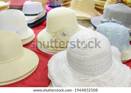 Ladies' bonnets.  Headwear shop concept, summer vacation. Royalty-Free Stock Photo #1964832508