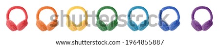 Set with different colorful soft earmuffs on white background. Banner design Royalty-Free Stock Photo #1964855887