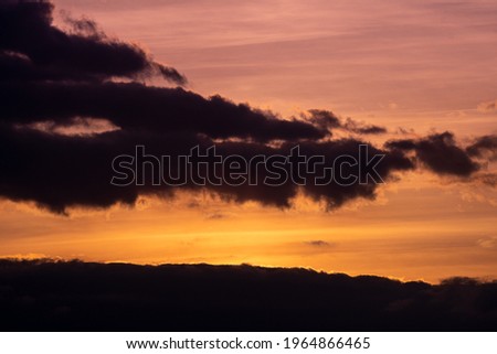 Climatic clouds after sunset background

