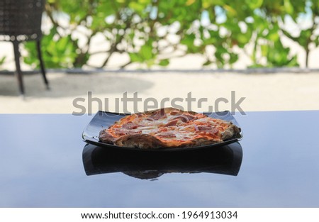 pizza margarita on the table outdoors