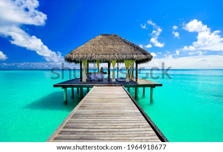 Relaxing massage in a bungalow in the Maldive resort. Massage in the bungalow on sea Royalty-Free Stock Photo #1964918677