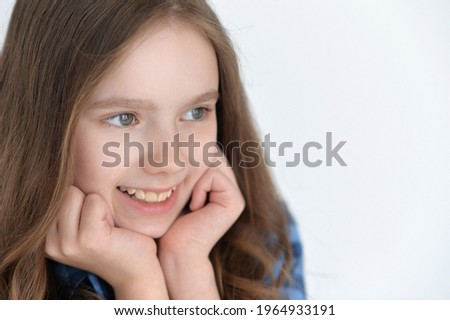 Portrait of cute girl looking away isolated on white background