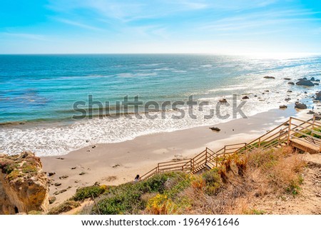 Matador beach and beautiful landscape with rocks and ocean against blue sky, California Royalty-Free Stock Photo #1964961646