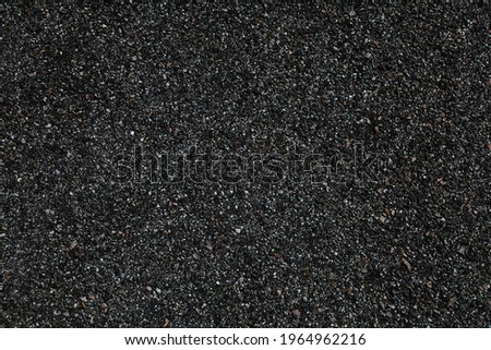 Asphalt black texture. Road pavement tarmac blacktop surface. Black background. Royalty-Free Stock Photo #1964962216