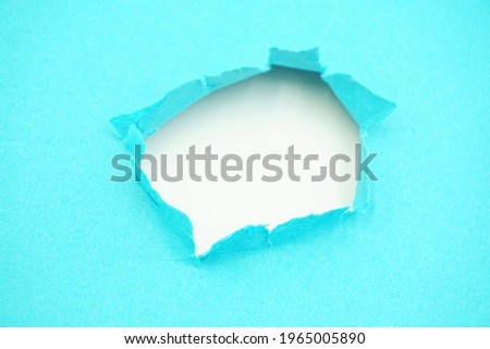 Torn paper, one sheet of torn paper with light blue color. multicolored torn background concept.