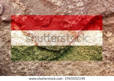 Vintage Hungary national flag icon pattern isolated on weathered solid rock wall background, abstract positive design faithful Hungarian politics society conflicts issues concept texture wallpaper