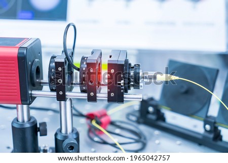 Experiment with laser device in optical laboratory Royalty-Free Stock Photo #1965042757