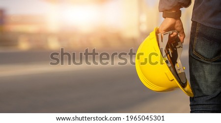Engineer holding helmet on site Road construction For the development of modern transportation systems, Technician worker hold hard hat safety first Royalty-Free Stock Photo #1965045301