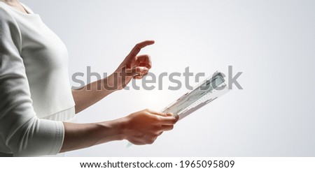 Woman hand touching virtual screen with pen. Online project management and financial diagrams visualization. Modern business innovation and intelligence technology. Data analysis futuristic concept