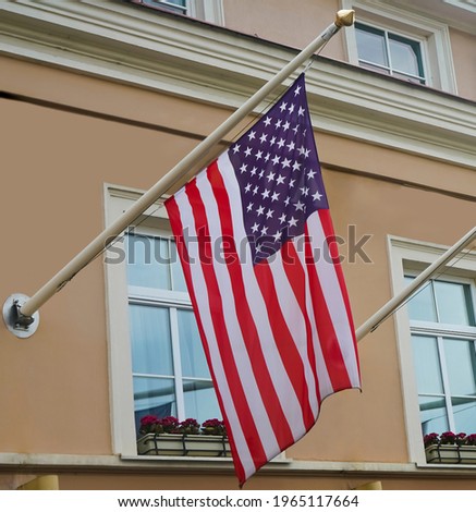 american  flag waving in the wind . Flags of the USA. embassy building in Vilnius