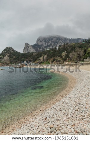 The city of Simeiz in the Crimea. Rock Cat. Beautiful bay in the Black Sea in spring. Blue clear water. Travel in the Crimea. Rock climbing area.