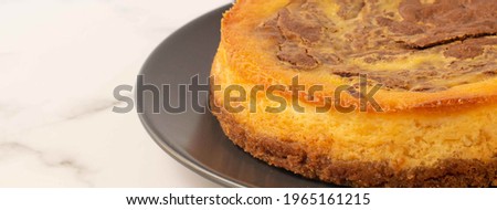 Banner of Cauliflower  and chocolate cheesecake on a white background.