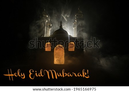 A realistic Mosque miniature with windows at night. Festive greeting card, invitation for Muslim holy month Ramadan Kareem. Selective focus