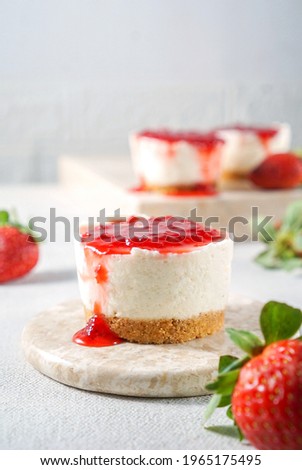 Mini No Bake Strawberry Cheesecake, in bright tone background and selective focus Royalty-Free Stock Photo #1965175495