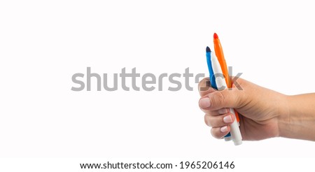 Hand holds colored pen markers - White background Royalty-Free Stock Photo #1965206146