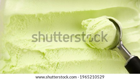 Closeup scooping lime flavoured sherbet ice cream, Top view Food concept.
