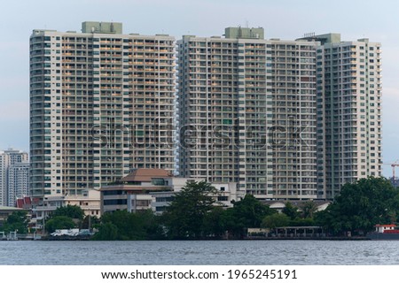 Aerial view of office buildings away in Bangkok, condominiums in Bangkok city with blue sky, Bangkok, Thailand.