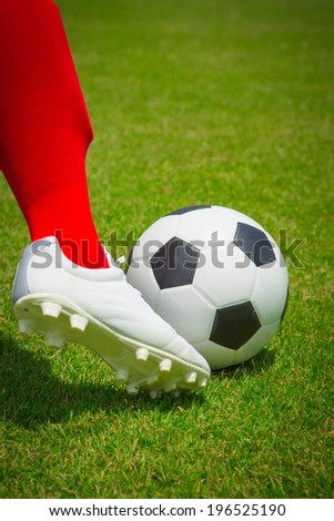 Soccesr player and ball isolated with white background