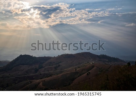 The sun shines through the clouds Evening in Mae Hong Son Province, Thailand