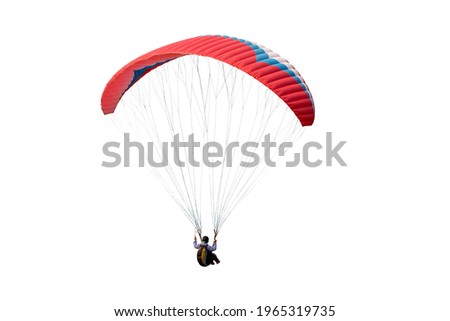 The sportsman flying on a paraglider. Beautiful paraglider in flight on a white background. isolated Royalty-Free Stock Photo #1965319735