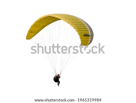 The sportsman flying on a paraglider. Beautiful paraglider in flight on a white background. isolated Royalty-Free Stock Photo #1965319984