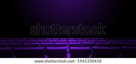 Cinema movie theatre with purple seats rows and a black copy space background. Horizontal banner