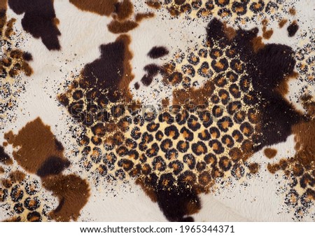 a trendy cowhide mixed with leopard print in a glitter effect