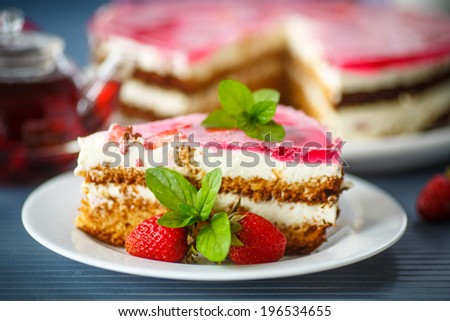 Honey cake with strawberries decorated with mint