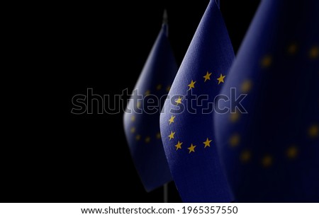 Small national flags of the European Union on a dark background