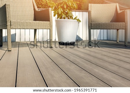 furnished outdoor terrace with wpc wood plastic composite decking boards Royalty-Free Stock Photo #1965391771