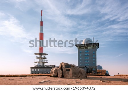 Mount Brocken in the Harz National Park, Saxony-Anhalt, Germany. Summit of the highest peak of the Harz mountains with summit stone, transmitter antenna and tower. Royalty-Free Stock Photo #1965394372