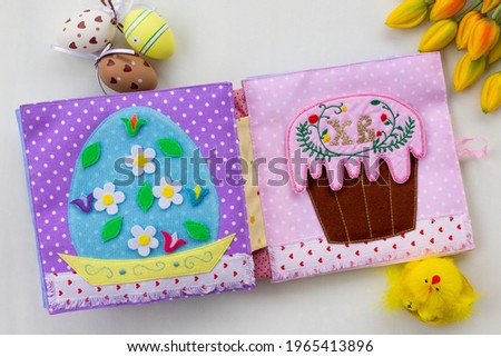 Handmade textile book for baby. Easter present for baby. Pages with felt eggs, birds and rabbits. Woolly toys on a string. Baby development. Educational toys. Fine motor skills.