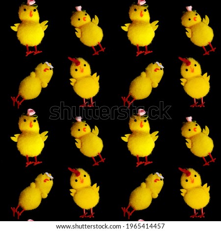 seamless pattern of yellow chickens isolated on a black background. High quality photo
