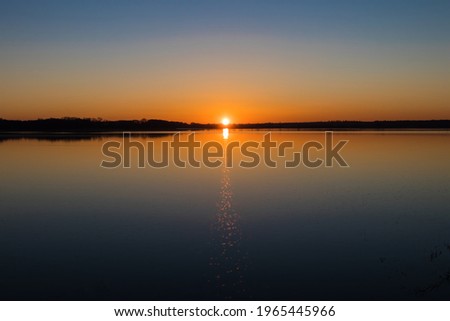 Romantic romantic sunset over the water-Beautiful Sunset over the fish pond Barycz Valley Nature Reserve Stawy Milickie