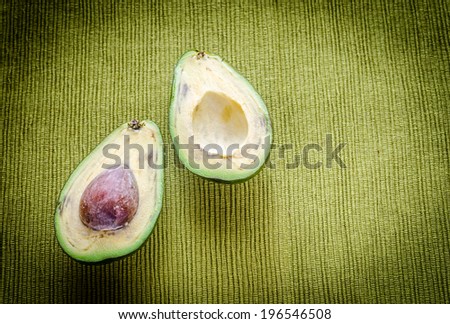 Avocado on the green background