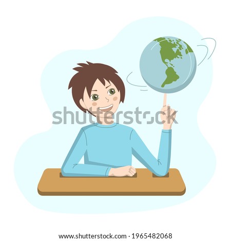 
Mischievous child at a desk in a geography lesson with a globe in his hands.
