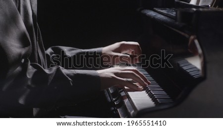 Piano music pianist hands playing. Musical instrument grand piano details 4K Royalty-Free Stock Photo #1965551410