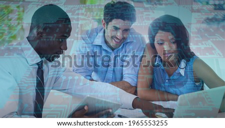 Composition of computer processor over business people using laptop. global technology, data processing and digital interface concept digitally generated image.