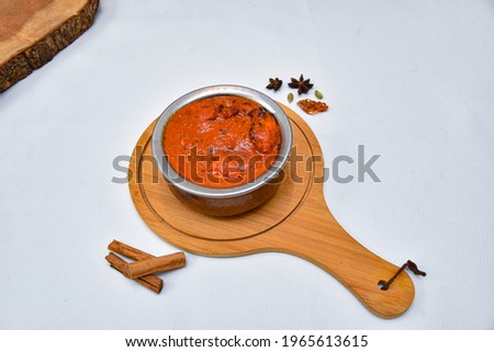  Chicken Tikka Masala curry hot and spicy gravy dish in copper Kadai wooden background in Punjab, Hyderabad Kashmir North India. Top view popular Indian curries nonveg food for Paratha, Roti