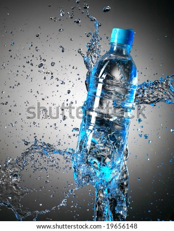 Bottle with pure water and splash around it.