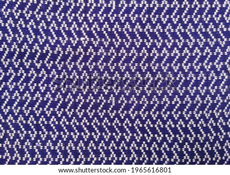 Abstract pattern on blue cotton background